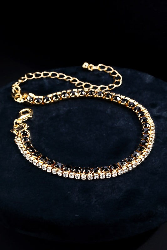 Very tasteful, dainty crystal bracelets offset in gold with a clasp closure. Great to stack multiples!
