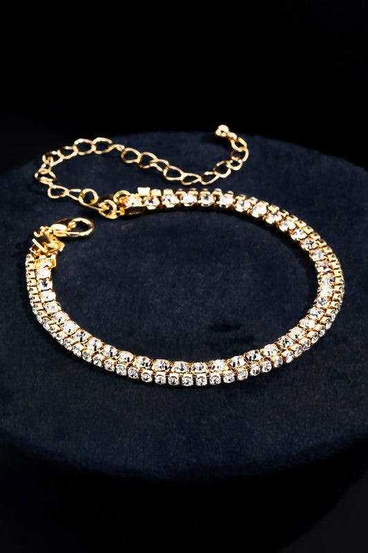 Very tasteful, dainty crystal bracelets offset in gold with a clasp closure. Great to stack multiples!
