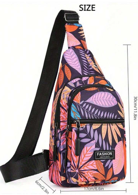 This is a fabulous handbag with leaf decor has a sleek adjustable strap that works well as a shoulder bag or worn sidecar. This bag has zippers aplenty to secure all of your valuables. 