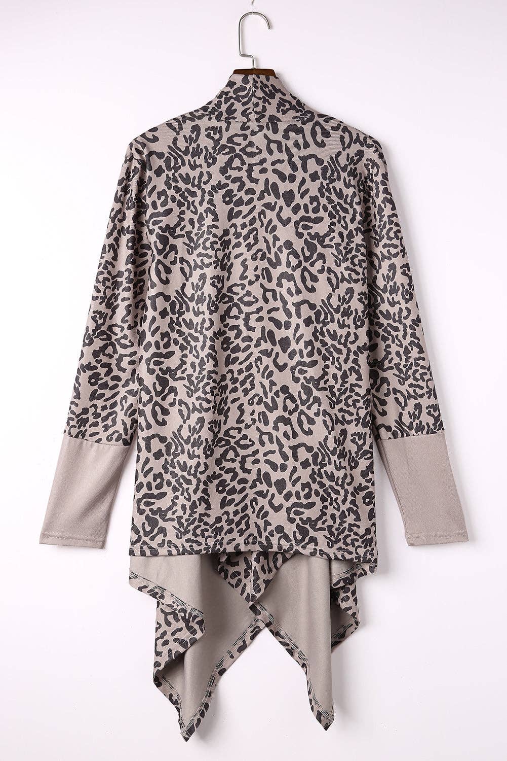 95% polyester / 3% elastane This simple cardigan is a trend setter featuring a bold leopard print the draped design is chic and the open front design looks like wearing a scarf . Style it with your favorite pair of denim or leggings and knee-high boots this fall.