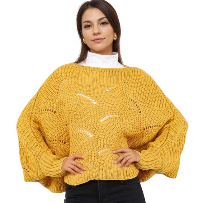 Woman wearing a yellow knitted sweater on a white background
