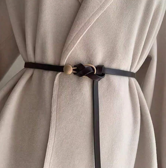 A funky faux leather wrap belt that's adjustable by personal style fit! Measuring 3/8" in width and a flat 46.5" length.