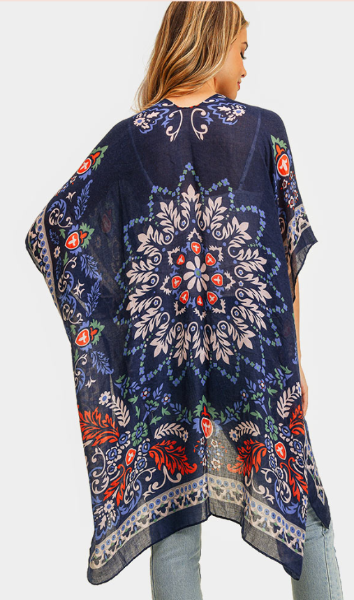 100 % Polyester This breezy, versatile kimono is adorned with a funky boho print in navy, red, and white - and it's one size fits all! Measures: 35" x 35"