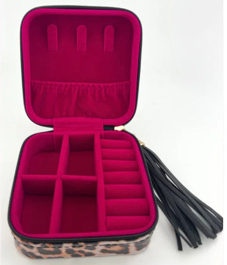 Pink jewelry case with leopard print base on a white background