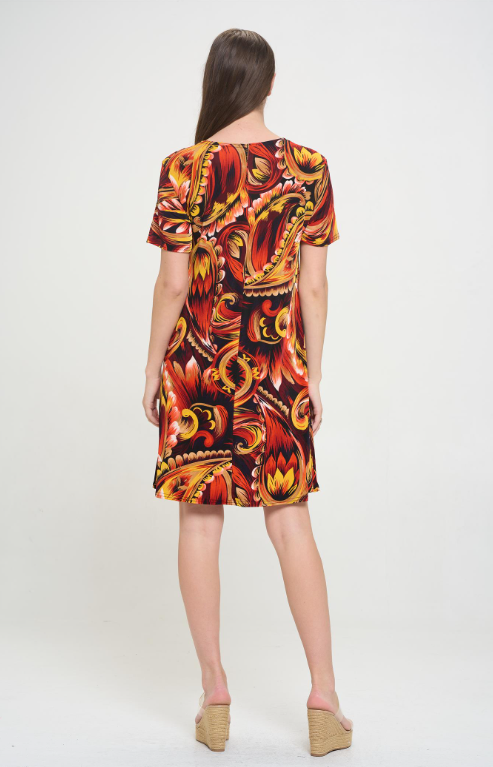 90% polyester / 10% spandex Get all-day comfort and style in this rust-colored paisley dress with a round neck, short sleeves, and flowy fabric that hits at the knees. Don't forget to complete your look with a jacket from this collection for any weather—perfect for any mood (or occasion)! Hand or machine wash in cold water. Made in U.S.A