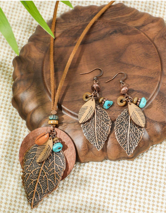 Get your fall vibes on with a funky Boho necklace set! Featuring multi-media, with warm copper-tones that add a pop of color and style to your bohemian look. Get ready to rock this unique and comfortable dangle necklace and earring combo!