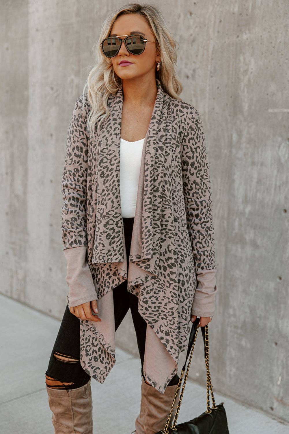 95% polyester / 3% elastane This simple cardigan is a trend setter featuring a bold leopard print the draped design is chic and the open front design looks like wearing a scarf . Style it with your favorite pair of denim or leggings and knee-high boots this fall.