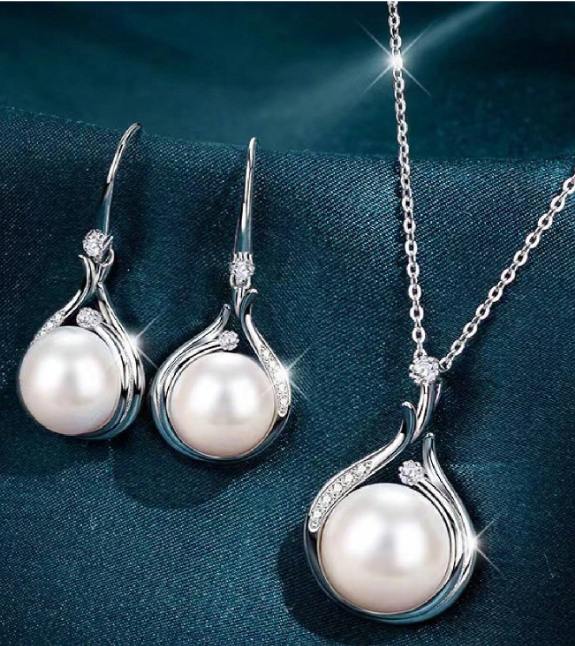 This dainty set packs a lot of sparkle power and pearl punch, while faux in nature this is a beautiful set sure to be a favorite!