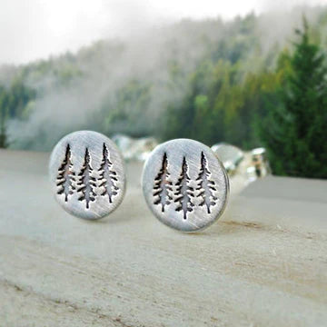 High Quality Stainless Steel Tree Trifecta! Three evergreens are metal stamped on these sweet little round post earrings in a simple statement look.