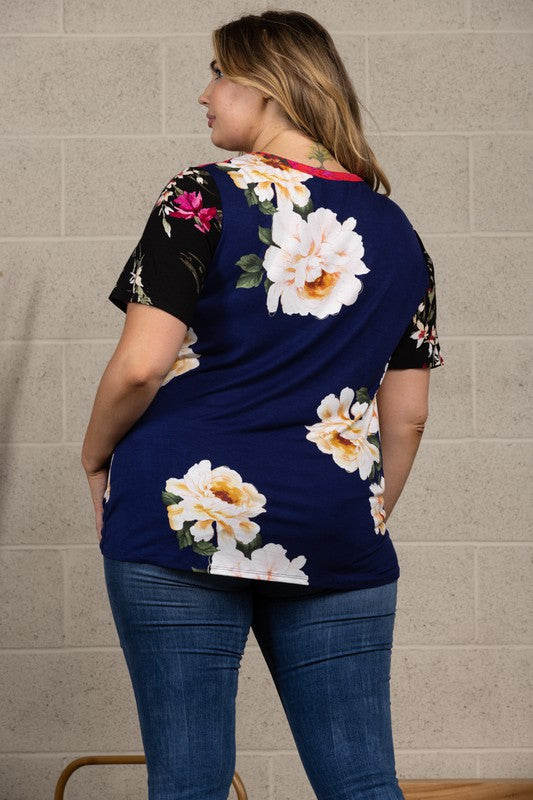 96% rayon / 4% spandex This is the All American top to celebrate in! The multi pattern front sports a block design with flattering side front tie and the back is a solid print. The rayon / spandex blend fabric gives that comfortable flowy drape we love!