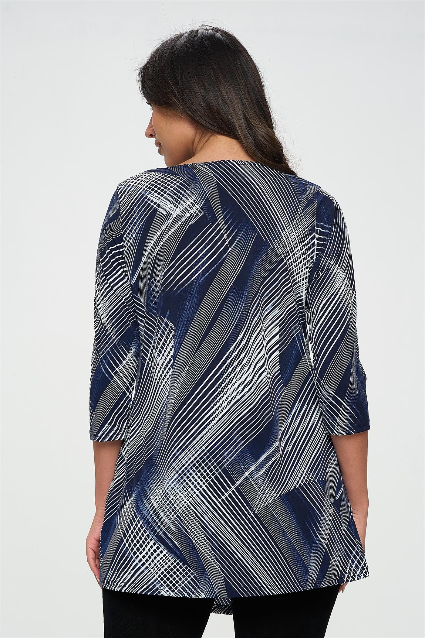 94% polyester / 6% spandex  This timeless tunic has a classic look with soft lines, 3/4-length sleeves, and its flowy fabric blend--guaranteed to be a hit the very first time you rock it!  Hand or machine wash in cold water.  Made in U.S.A