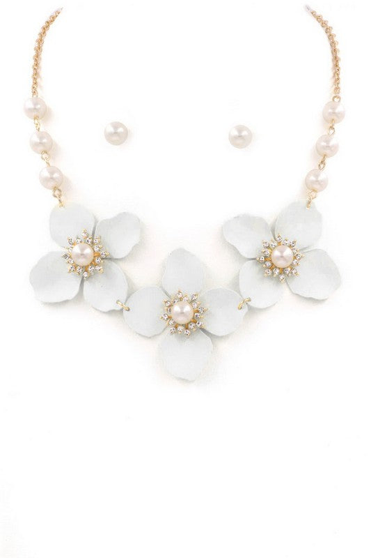 <p>Dress up your neck with these charming white blossoms and pearls, and don't forget the extra pearls for your ears! This stunning set is just what you need to stand out at any festive gathering.</p> <p>Size: Necklace 15.5"</p>