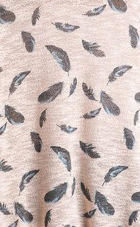 <p>95 polyester / 5% elastane</p> <p>This top is covered in feathers and light as one too! This blush beauty is sure to get you compliments and don't be afraid to size down on this one!</p>