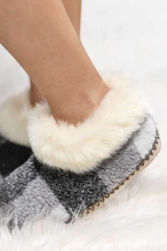 Lining:100% polyester Out-sole: 100% polyester  Cozy doesn't get any cozier than these faux furrrry slippers with non-skid bottoms. The lining adds another layer of ahhhh as you lounge around home in style and comfort.  Sizing: S/M: shoe size 6-7 L/XL: shoe size 8-10