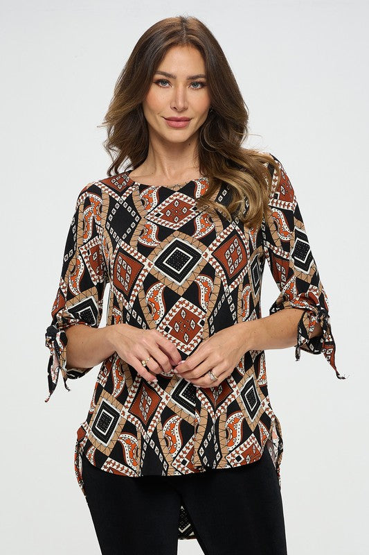 90% polyester / 10% spandex  The best part of dressing up is when it can be in a soft flowing top! This gorgeous earth toned top features a modest round neck and a tied off bell sleeve at the elbow making it a perfect choice as business casual or casual dress up!  Made in USA