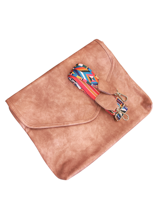 Vegan Leather  Discover an exceptional crossbody bag with hidden features! Boasting a zigzag design interior, 2 pockets, and zippered compartment inside and sporting a snap closure, zipper pocket outside with a customizable strap that can be removed or adjusted to your liking.  Size: 13.5"x10.25"