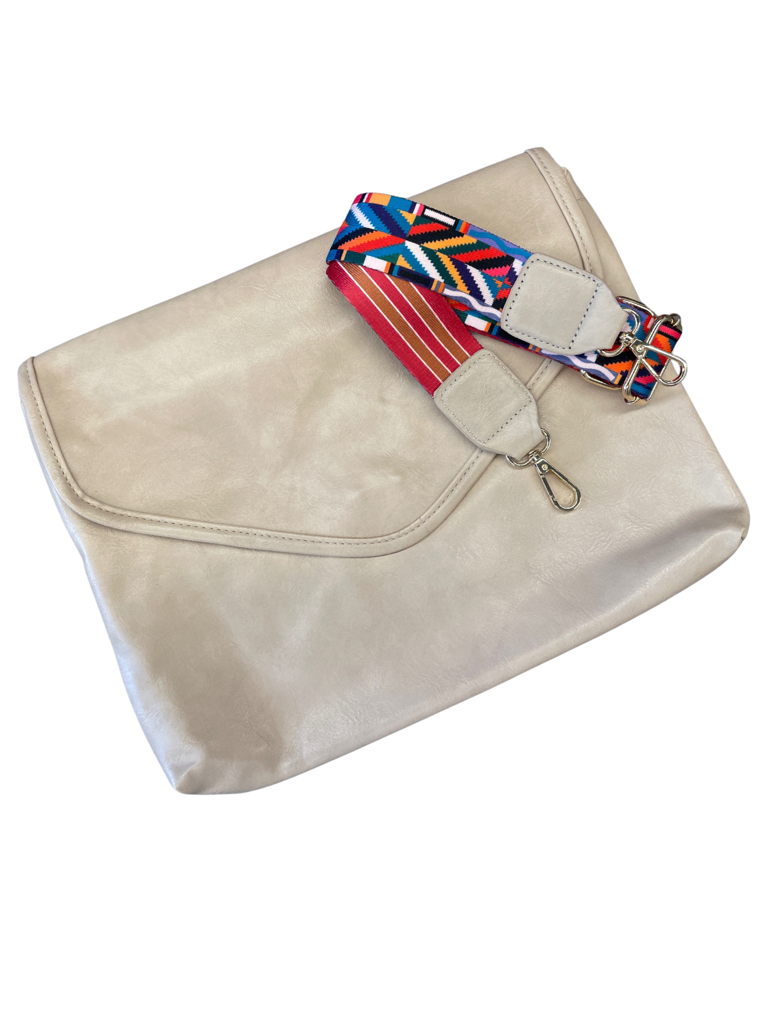 Vegan Leather  Discover an exceptional crossbody bag with hidden features! Boasting a zigzag design interior, 2 pockets, and zippered compartment inside and sporting a snap closure, zipper pocket outside with a customizable strap that can be removed or adjusted to your liking.  Size: 13.5"x10.25"