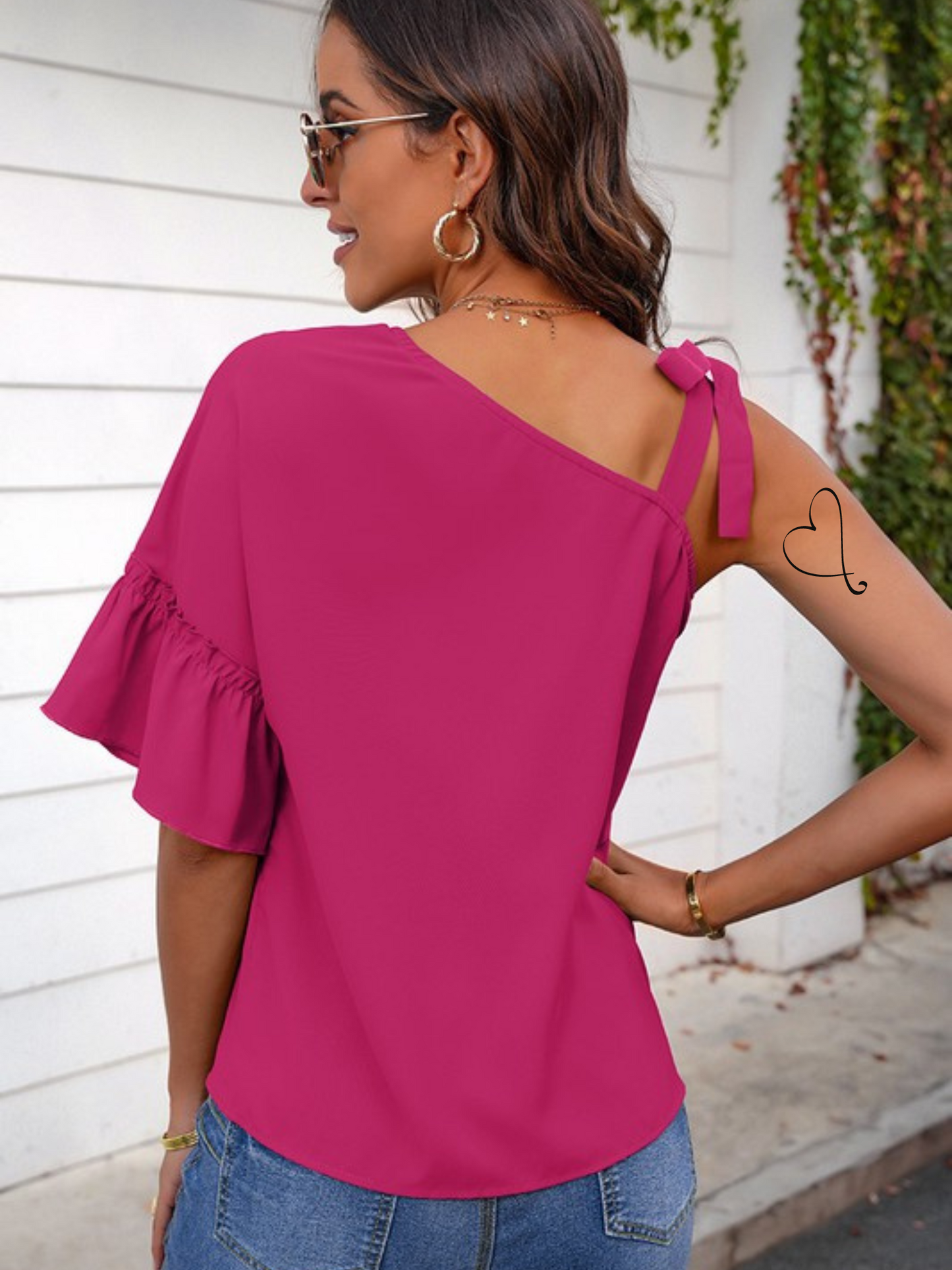 100% polyester  This off the shoulder tie strap ruffle sleeve top is a stunner in fuschia! Sneak it into work with a jacket, shed the jacket for a great post work play date!