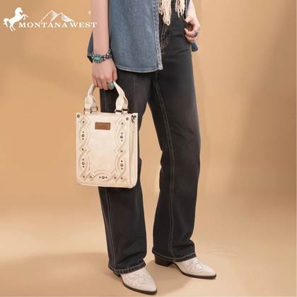 Person holding a beige handbag with Montana West logo on a beige background