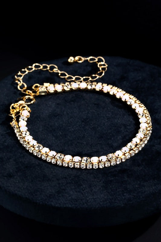 Very tasteful, dainty crystal bracelets offset in gold with a clasp closure. Great to stack multiples!