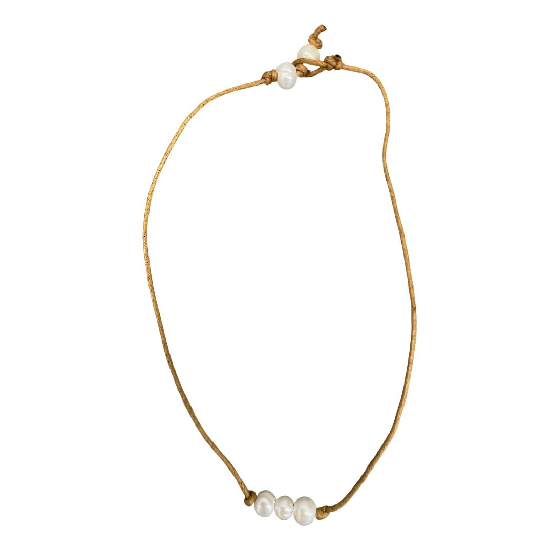 Simply delightful! This leather necklace with 5 faux pearls adds a subtle touch of style and  different vibes- from boho to country or even business casual! 