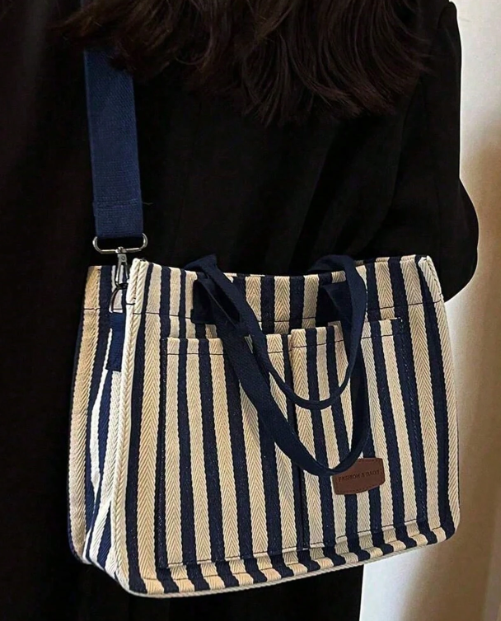 100% polyester

Get ready to slay with this bold Vertical Striped Hobo Shoulder Bag!This bag's spacious interior ensures you have plenty of room for all your essentials and is the perfect pairing for casual or dress!