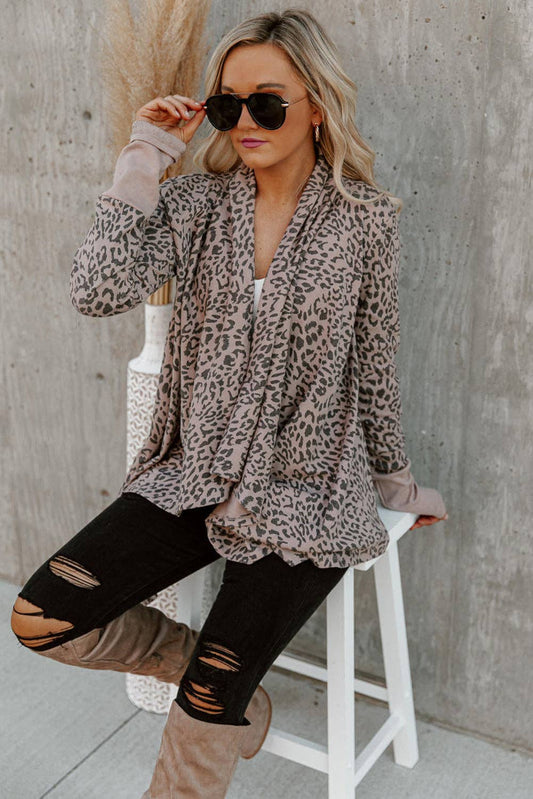 95% polyester / 3% elastane  This simple cardigan is a trend setter featuring a bold leopard print the draped design is chic and the open front design looks like wearing a scarf .&nbsp; Style it with your favorite pair of denim or leggings and knee-high boots this fall.