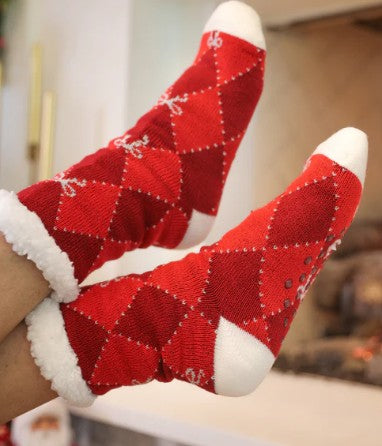 Red and white checkered socks with a pattern on a blurred background