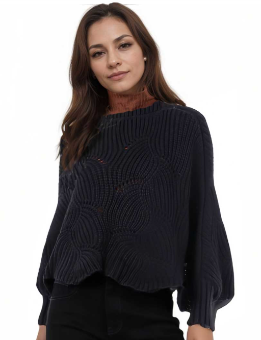 Woman wearing a dark blue knitted sweater on a white background