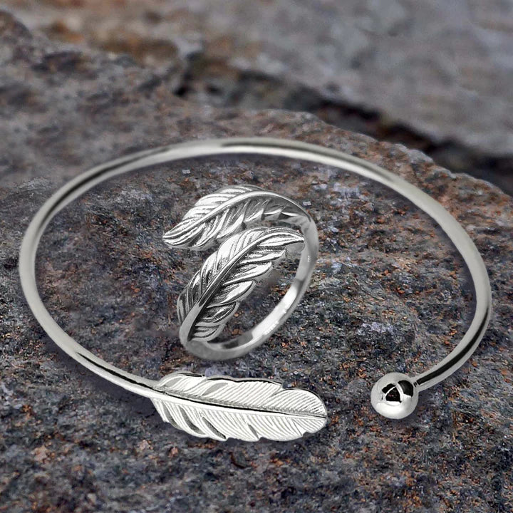 High Quality Stainless Steel  Dynamic Duo! This dainty adjustable bracelet features a feather and is accompanied by an adjustable feather ring- great for a casual or formal occasion!