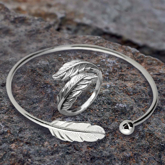 High Quality Stainless Steel  Dynamic Duo! This dainty adjustable bracelet features a feather and is accompanied by an adjustable feather ring- great for a casual or formal occasion!