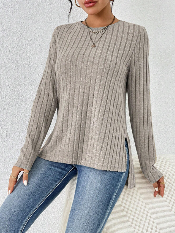 96% polyester / 4% elastane  Super soft, lightweight knit top featuring a comfortable round neck and split hem is a great stand alone or layering piece in a light tan color.  Machine Washable