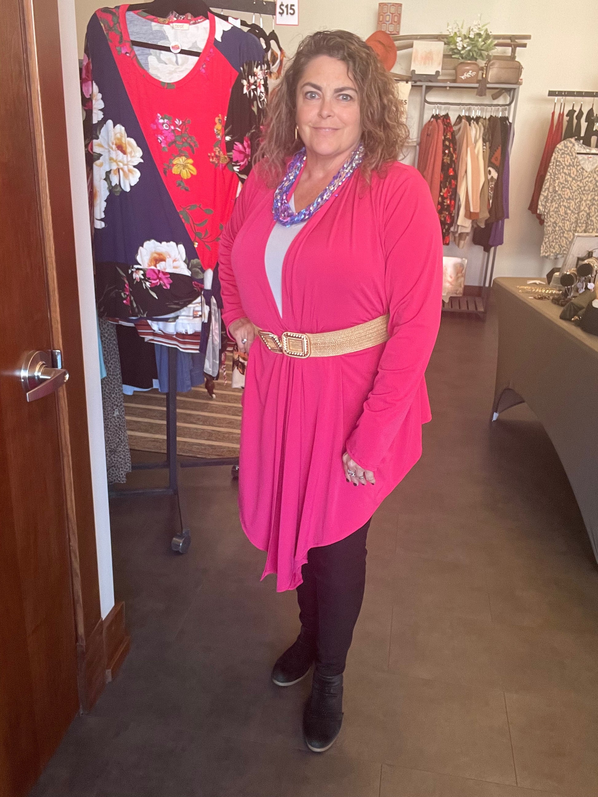 https://splashofpearl.com/products/jersey-cardican-fuschia  95% polyester 5% Spandex This cardigan has endless possibilities for style and comes with a guide for 12 different ways to wear it! That's getting mileage out of a classic piece for sure! This is a heavy knit- great for all 4 seasons! Machine wash warm, gentle cycle. Hang to dry, or tumble dry low.