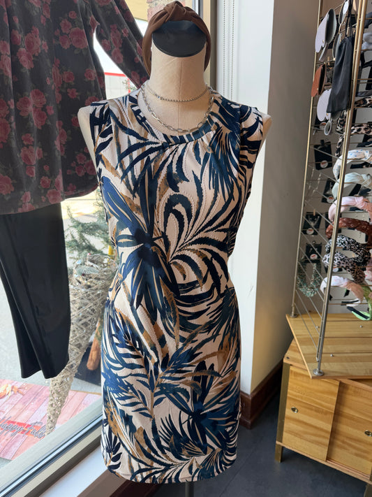 Mannequin wearing a patterned dress with a blurred background