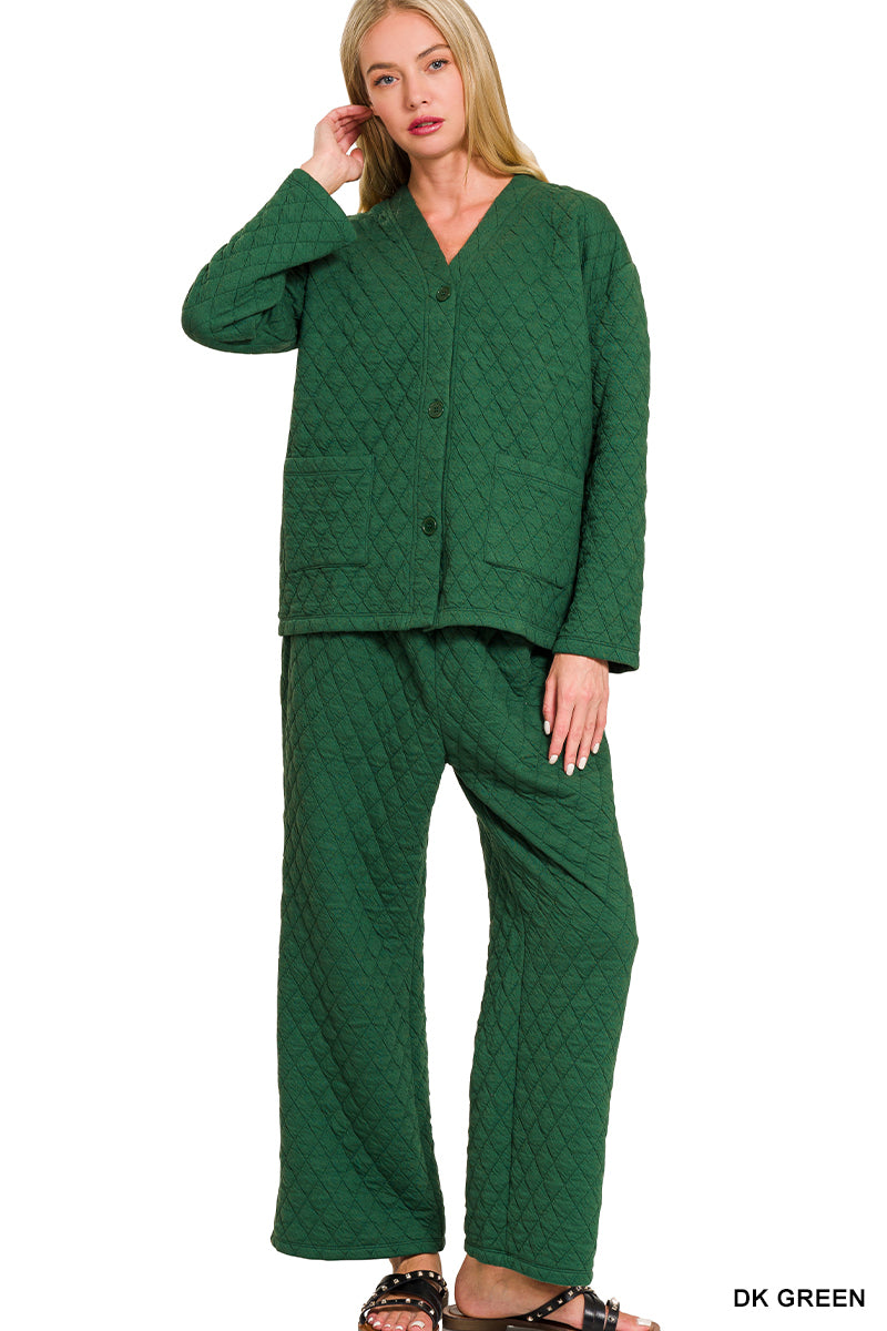 Woman wearing a green quilted outfit on a white background