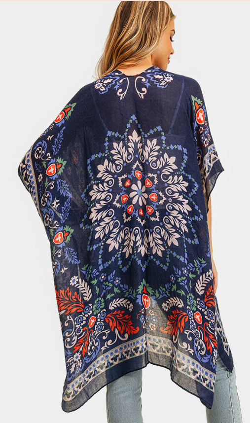 100 % Polyester  This breezy, versatile kimono is adorned with a funky boho print in navy, red, and white - and it's one size fits all!  Measures: 35" x 35"