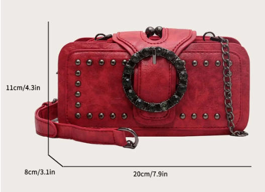 Sassy Satchel? You bet! This petite purse packs a bold punch with the studs and decorative buckle.