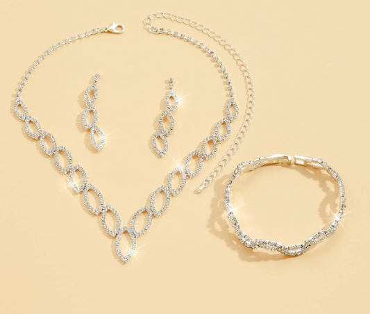 Make your holiday party or dress up event sparkle with this blingy jewelry set! Perfect for standing out and having some fun. This set includes a necklace, earrings &amp; a bracelet at a great price!