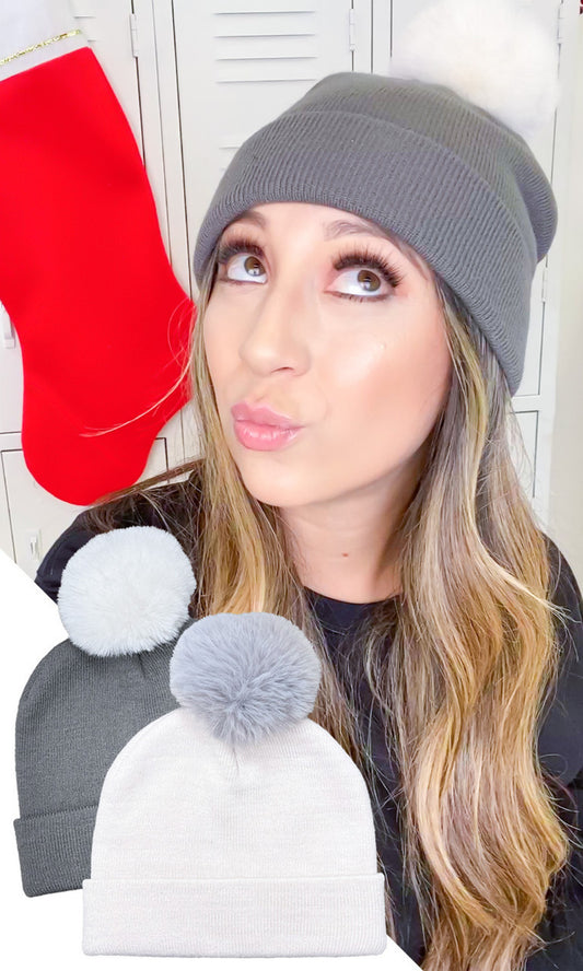100% polyester

Keep your noggin warm in any elements with this perfect day-to-day beanie! The simple design includes a banded bottom and a fluffy fur pom on top.

Care Instructions: Hand wash. Lay flat to dry.