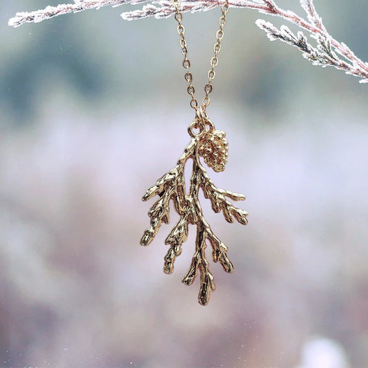 High Quality Stainless Steel  Simply standout necklace! This necklace is a delicate chain with a dazzling evergreen branch and pinecone charms that will have everyone where you got this!  16" chain is adjustable.