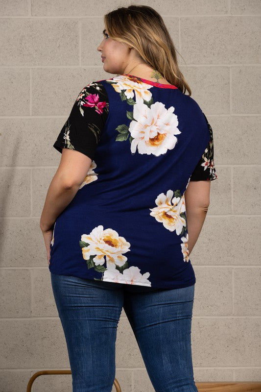 96% rayon / 4% spandex  This is the All American top to celebrate in! The multi pattern front sports a block design with flattering side front tie and the back is a solid print. The rayon / spandex blend fabric gives that comfortable flowy drape we love!